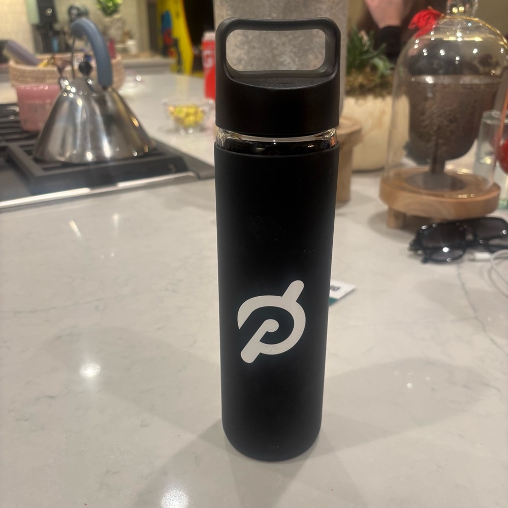 Peloton glass water bottle with rubber cover